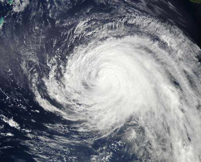 Hurricane Igor (2010) over Bermuda and the MBL's Oceanic Flux Program research station. Image Credit: NASA MODIS
